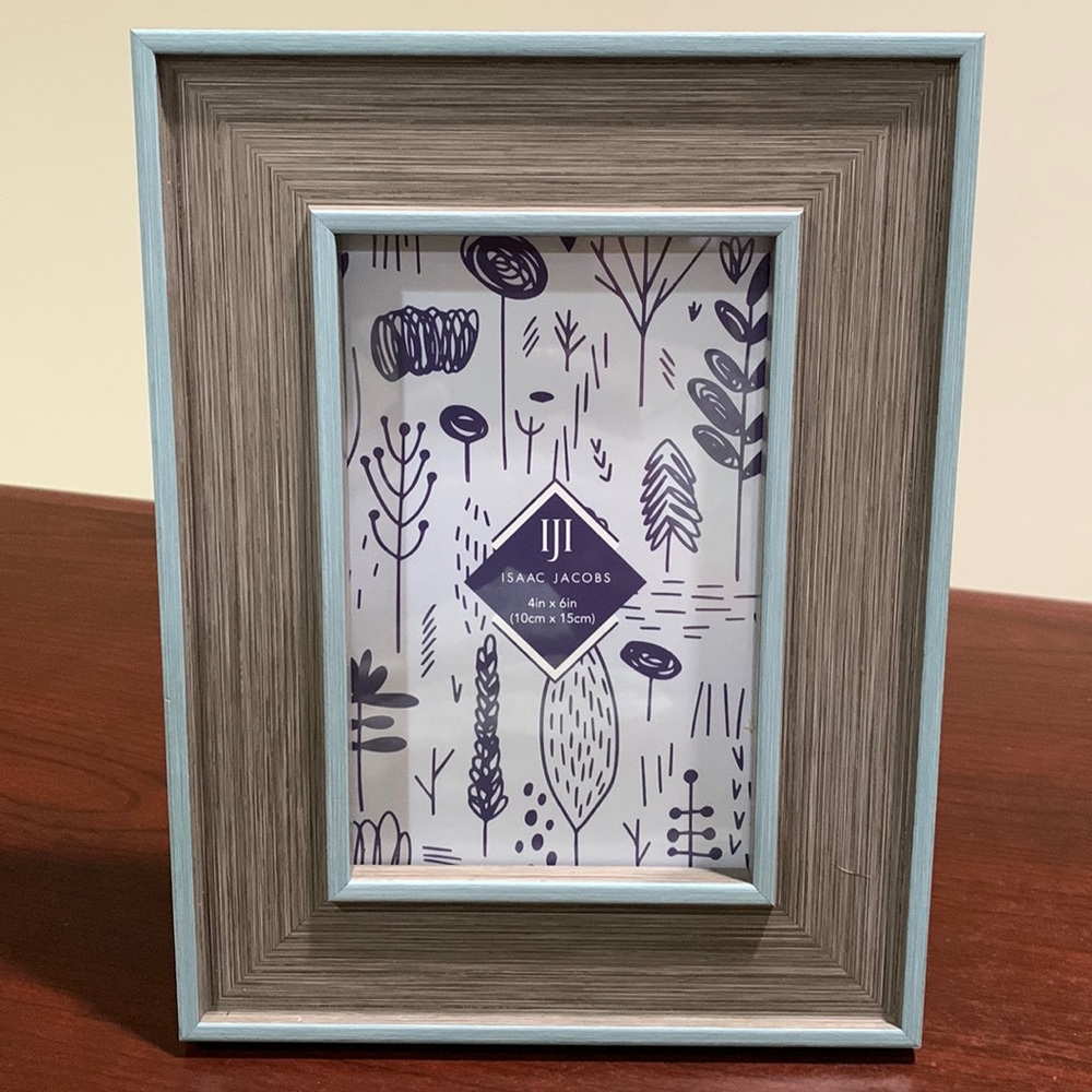 4x6” plastic picture frame, brownish gray with light blue trim, never used